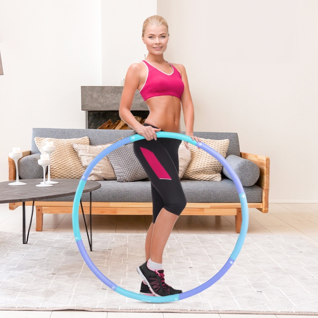 Modella che si allena con il cerchio Hula-Hoop AsVIVA HH1 per una pancia tonica e piatta