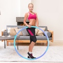 Modella che si allena con il cerchio Hula-Hoop AsVIVA HH1 per una pancia tonica e piatta